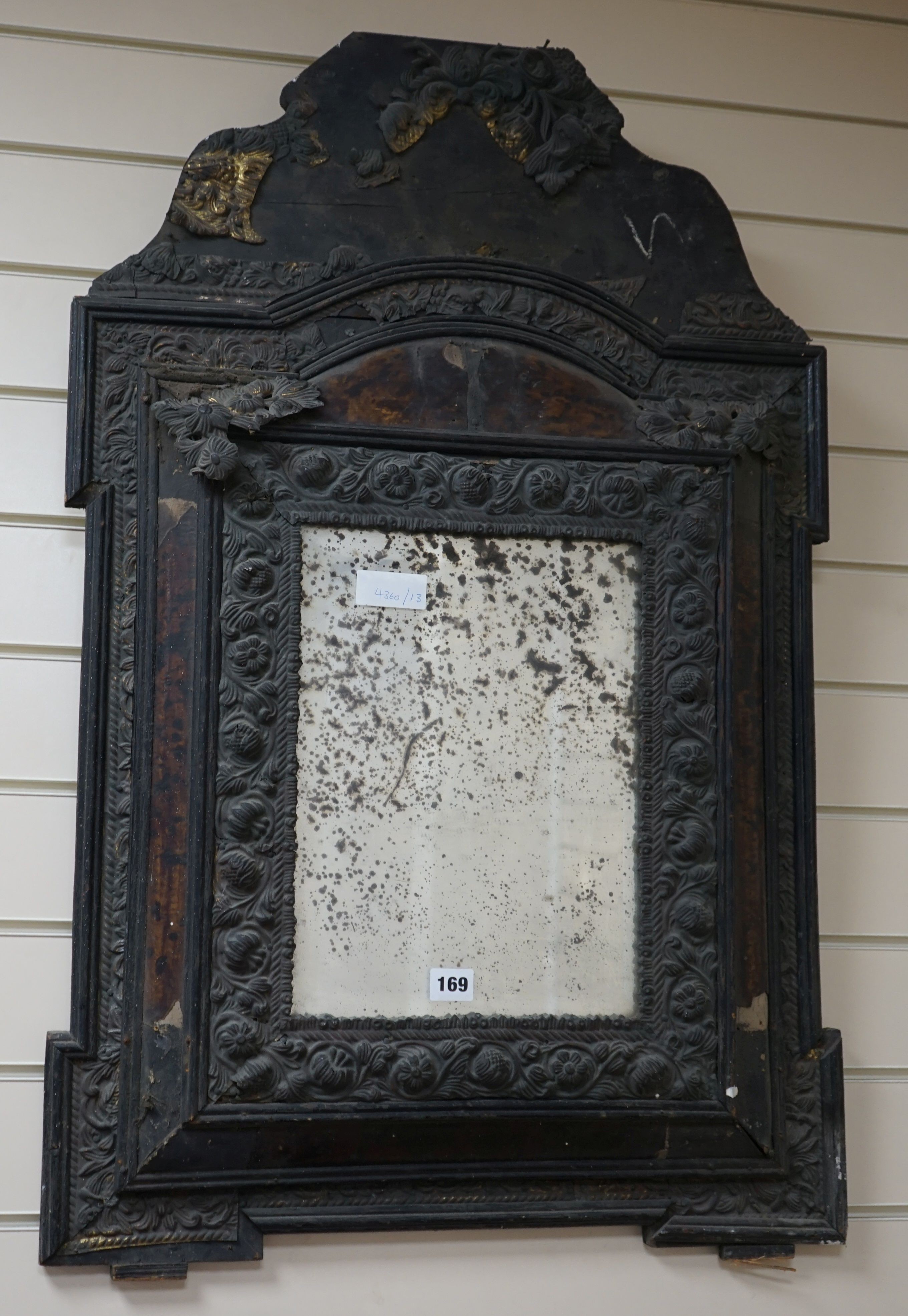 A 19th century Dutch brass and tortoiseshell wall mirror, width 58 cms, height 90 cms.